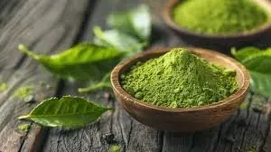 Brand photo of matcha green tea powder and fresh tea leaves, saved under a file name that mentions cinnamon